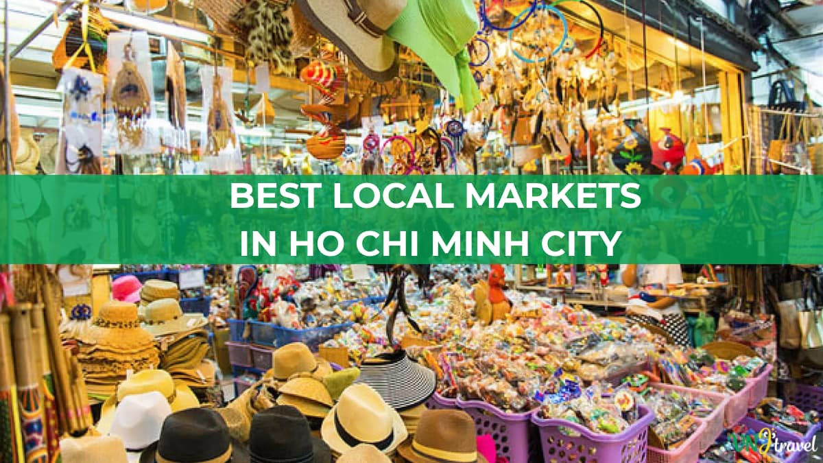 A colorful indoor market filled with hats, souvenirs, toys, and handicrafts, with a green banner reading “BEST LOCAL MARKETS IN HO CHI MINH CITY.”
