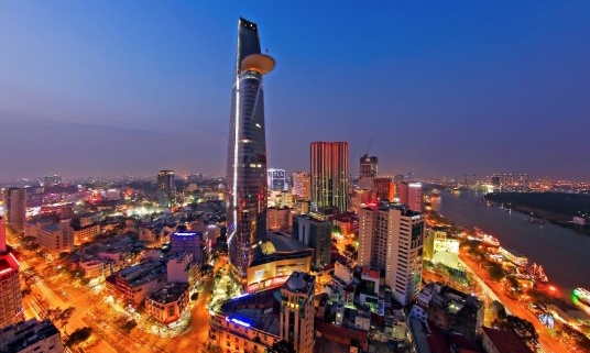 Bitexco Financial Tower illuminated at night in Ho Chi Minh City skyline