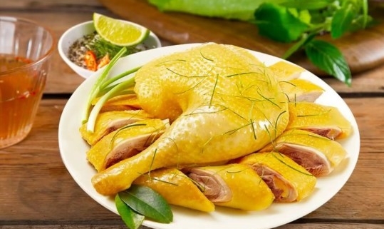 Traditional Vietnamese boiled chicken served for Tet holiday with herbs and dipping sauce