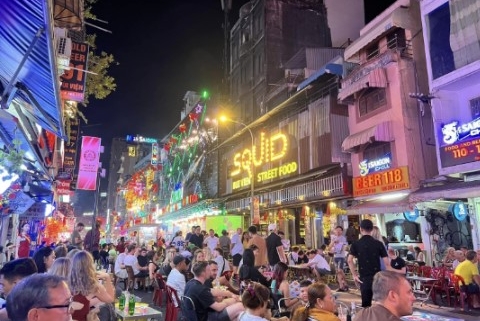 Bui Vien Walking Street at night with crowds, neon lights, and lively nightlife in Ho Chi Minh City