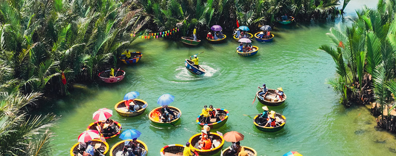 Families riding basket boats in Bay Mau Coconut Forest, Hoi An