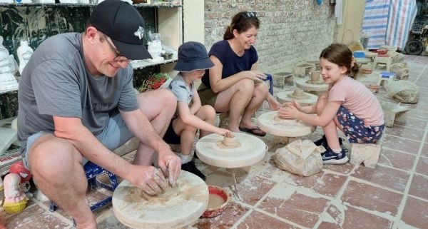 Family making pottery at Bat Trang Pottery Village