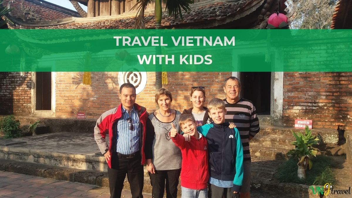 Family traveling in Vietnam with children visiting a traditional Vietnamese temple, showcasing cultural exploration and family-friendly travel experiences.