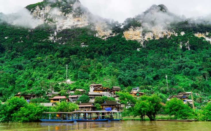 Pac Ngoi ethnic village near Ba Be Lake with traditional stilt houses and mountain scenery in Northern Vietnam