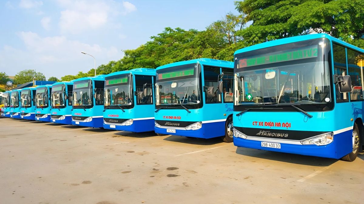 Hanoi electric buses lined up at a depot, providing eco-friendly public transportation in Vietnam's capital.