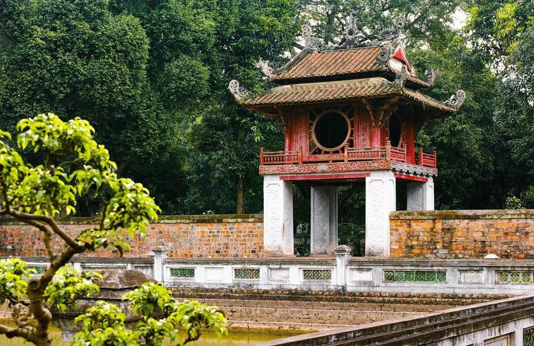 The Pavilion of the Constellation of Literature at Temple of Literature in Hanoi, Vietnam surrounded by trees and a peaceful courtyard
