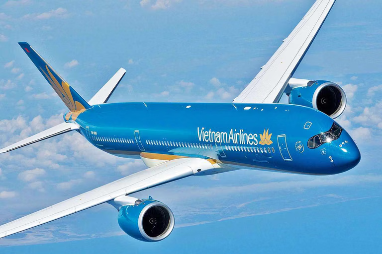 A Vietnam Airlines aircraft flying above the clouds during an international flight from India to Vietnam