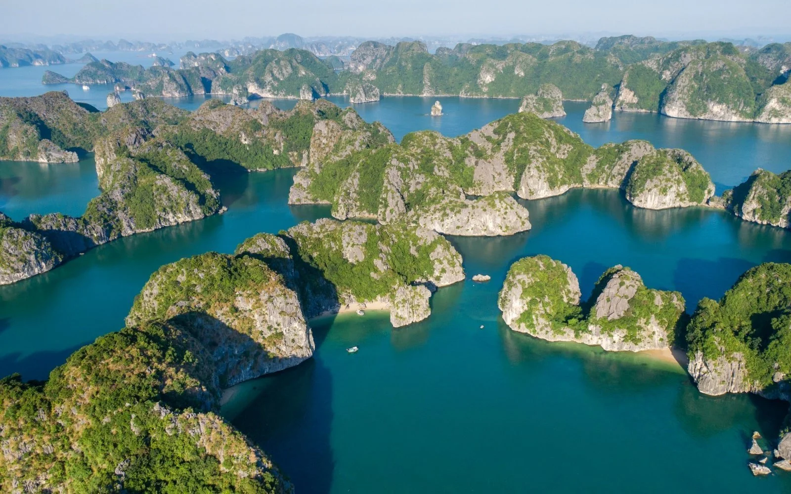 Aerial view of Lan Ha Bay with emerald waters and hundreds of limestone islands in northern Vietnam.