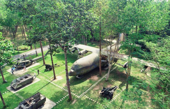 Military aircraft and weapon relics on display at Cu Chi Tunnels outdoor museum