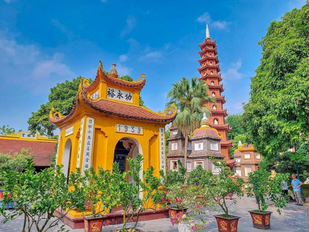 Tran Quoc Pagoda architecture and the iconic red multi-storey stupa in Hanoi.