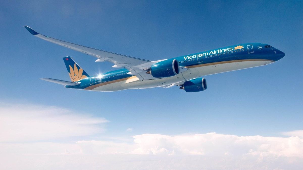 Vietnam Airlines aircraft operating an international flight route between Vietnam and India at an airport runway.