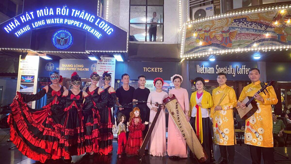 Performers and traditional musicians outside Thang Long Water Puppet Theatre in Hanoi before a Vietnamese water puppet show.
