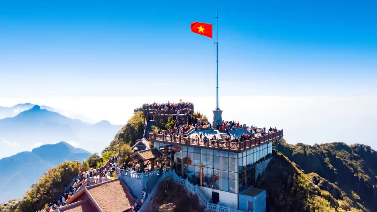 Fansipan Peak in Sapa surrounded by clouds and spectacular mountain scenery